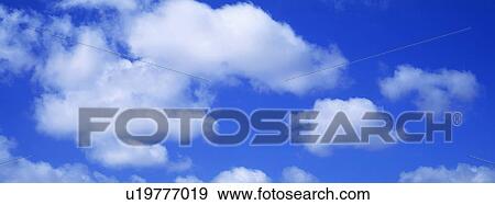Blue skies with clouds View Large Photo Image Stock Photo - Blue skies with clouds. Fotosearch