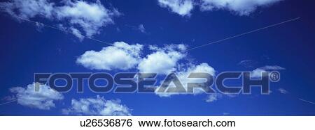 Blue skies with clouds View Large Photo Image Stock Photograph - Blue skies with clouds. Fotosearch