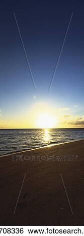 Beach at sunset View Large Photo Image Stock Photograph - Beach at sunset. Fotosearch