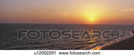 Beach shoreline at dusk View Large Photo Image Stock Image - Beach shoreline at dusk. Fotosearch