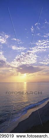 Beach shoreline at sunset View Large Photo Image Stock Photo - Beach shoreline at sunset. Fotosearch