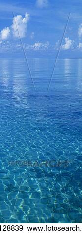 Clear waters and blue sky View Large Photo Image Stock Photo - Clear waters and blue sky. Fotosearch