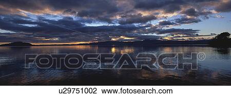 Landscape view with body of water at dusk View Large Photo Image Stock Image - Landscape view with body of water at dusk. Fotosearch