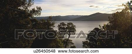 Landscape view with body of water View Large Photo Image Stock Photo - Landscape view with body of water. Fotosearch