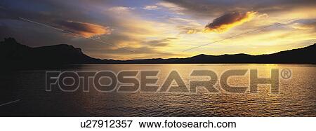 Stock Photo - Landscape view with body of water. Fotosearch
