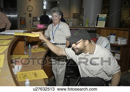 Stock Image - A man enjoying himself as he works.. Fotosearch