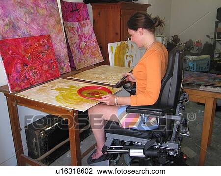 Artist (female wheelchair user) puts paint and brush to canvas in her studio. View Large Photo Image Stock Image - Artist (female wheelchair user) puts paint and brush to canvas in her studio.. Fotosearch