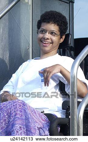 Beautiful young woman in a wheelchair. View Large Photo Image Stock Image - Beautiful young woman in a wheelchair.. Fotosearch