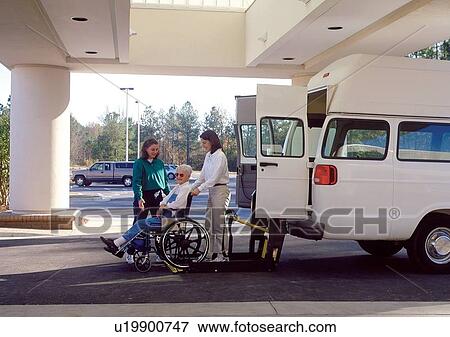Stock Photo - Elderly woman with a disability preparing to be lifted into the van to get where she wants to go.. Fotosearch