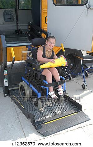 Girl with multiple physical disabilities getting on the school bus to go home, with art project in tow, after a fun day at school. View Large Photo Image Stock Image - Girl with multiple physical disabilities getting on the school bus to go home, with art project in tow, after a fun day at school.. Fotosearch