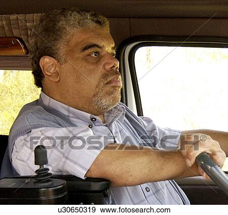 Man using driving a van with assistive technology. View Large Photo Image Stock Photo - Man using driving a van with assistive technology.. Fotosearch