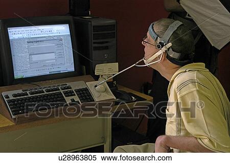 Man with significant disabilities utilizing headgear to operate communications apparatus. View Large Photo Image Stock Photography - Man with significant disabilities utilizing headgear to operate communications apparatus.. Fotosearch