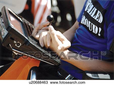 Person with a disability who utilizes wheelchair for mobility and an assistive technology device for communication. View Large Photo Image Stock Image - Person with a disability who utilizes wheelchair for mobility and an assistive technology device for communication.. Fotosearch