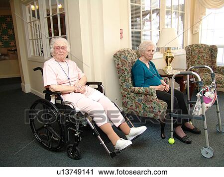 Two ladies rest in the lobby of a nursing home. View Large Photo Image Stock Image - Two ladies rest in the lobby of a nursing home.. Fotosearch