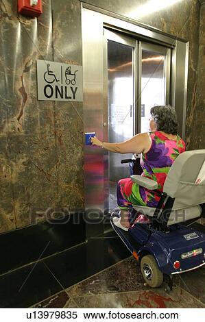 Woman entering an accessible bathroom. View Large Photo Image Stock Photography - Woman entering an accessible bathroom.. Fotosearch