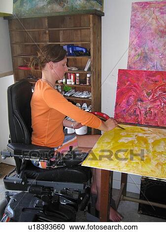Young woman (electric wheelchair user) paints in her studio. View Large Photo Image Stock Image - Young woman (electric wheelchair user) paints in her studio.. Fotosearch