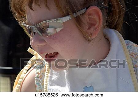 Adorable little girl with multiple disabilities enjoying a day outside. View Large Photo Image Stock Photograph - Adorable little girl with multiple disabilities enjoying a day outside.. Fotosearch