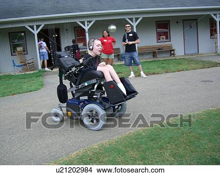 Picture - Boy, at camp, in his wheelchair.. Fotosearch