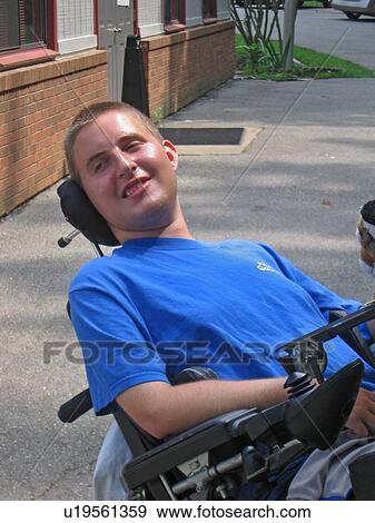 Stock Photo - Boy, in wheelchair, at Muscular Dystrophy Association Summer Camp.. Fotosearch