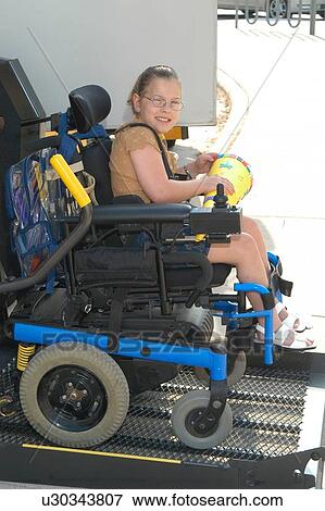 Girl with multiple physical disabilities transferring from a vehicle lift to the ground in her power wheelchair. View Large Photo Image Stock Photo - Girl with multiple physical disabilities transferring from a vehicle lift to the ground in her power wheelchair.. Fotosearch