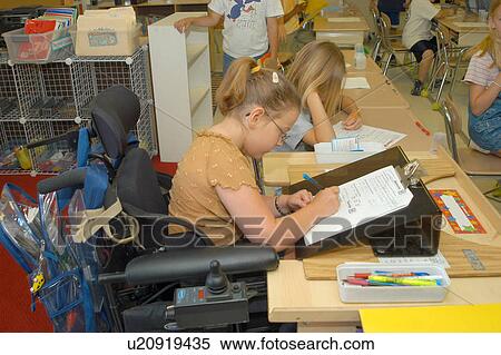 Girl, with multiple physical disabilities, doing her school work in class. She utilizes a power wheelchair for mobility. View Large Photo Image Stock Photography - Girl, with multiple physical disabilities, doing her school work in class. She utilizes a power wheelchair for mobility.. Fotosearch