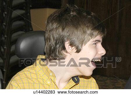 Stock Image - Happy boy with severe/profound mental retardation.. Fotosearch