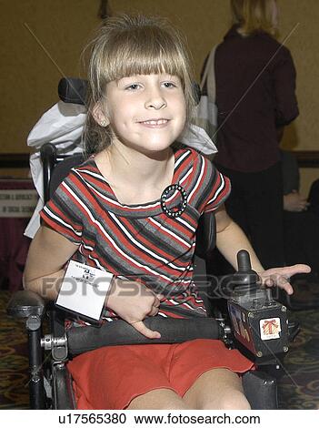 Happy little girl with multiple disabilities utilizing a powered chair for mobility. View Large Photo Image Stock Image - Happy little girl with multiple disabilities utilizing a powered chair for mobility.. Fotosearch