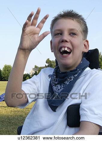 Image of a teenage boy with disabilities captured during a happy moment. View Large Photo Image Stock Image - Image of a teenage boy with disabilities captured during a happy moment.. Fotosearch