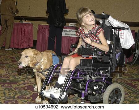 Little girl with a disability, utilizing a wheelchair for mobility and a service dog for assistance, smiling for the camera. View Large Photo Image Stock Image - Little girl with a disability, utilizing a wheelchair for mobility and a service dog for assistance, smiling for the camera.. Fotosearch