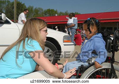 Little girl with a disability, utilizing a wheelchair for mobility, preparing to visit a petting zoo. View Large Photo Image Stock Photography - Little girl with a disability, utilizing a wheelchair for mobility, preparing to visit a petting zoo.. Fotosearch