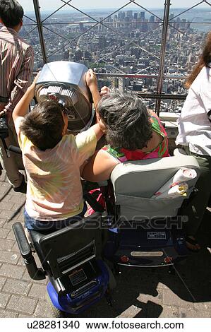 Mother and son with disabilities sightseeing while on vacation. View Large Photo Image Stock Image - Mother and son with disabilities sightseeing while on vacation.. Fotosearch