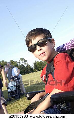 One cool kid with a disability having a great time at a local park. View Large Photo Image Stock Image - One cool kid with a disability having a great time at a local park.. Fotosearch