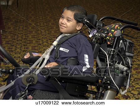 Young boy with significant disabilities getting around in the community with help from cutting edge assistive technology. View Large Photo Image Stock Image - Young boy with significant disabilities getting around in the community with help from cutting edge assistive technology.. Fotosearch