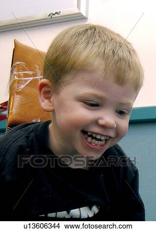 Absolutely adorable little boy with disabilities laughing with pleasure. View Large Photo Image Picture - Absolutely adorable little boy with disabilities laughing with pleasure.. Fotosearch