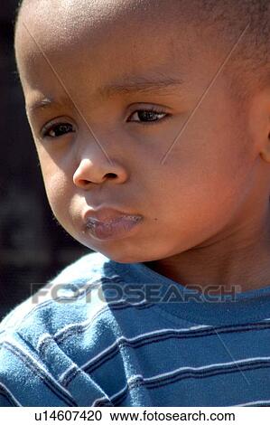 Little boy with a disability deeply contemplating something he is viewing. View Large Photo Image Stock Image - Little boy with a disability deeply contemplating something he is viewing.. Fotosearch