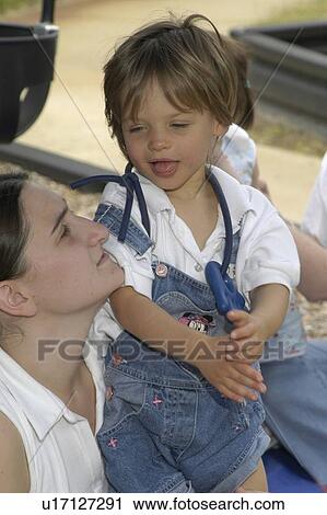 Loving look shared between a mother and her child with disabilities. View Large Photo Image Stock Image - Loving look shared between a mother and her child with disabilities.. Fotosearch
