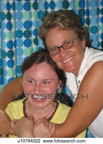 Mother and daughter (wheelchair user) share a laugh. View Large Photo Image Stock Image - Mother and daughter (wheelchair user) share a laugh.. Fotosearch