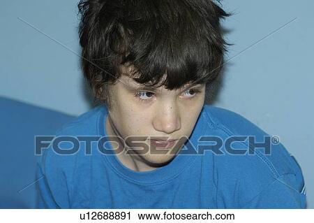 The classic face/expression of a young man with autism. View Large Photo Image Stock Image - The classic face/expression of a young man with autism.. Fotosearch