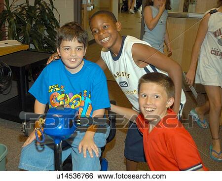 Three friends having a great day, smiling for the camera. One boy has Muscular Dystrophy and utilizes a scooter/cart for mobility assistance. View Large Photo Image Stock Photograph - Three friends having a great day, smiling for the camera. One boy has Muscular Dystrophy and utilizes a scooter/cart for mobility assistance.. Fotosearch