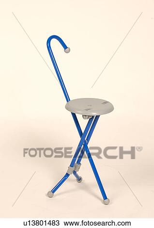 Stock Image - A cane that converts to a quick stool or seat.. Fotosearch