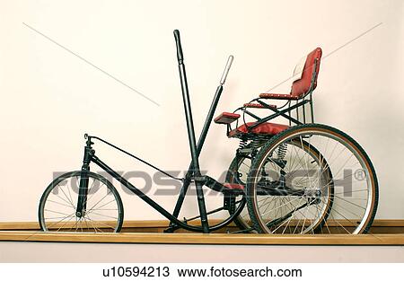 Interesting and unusual antique wheelchair, hand-powered with a rowing type feature. View Large Photo Image Stock Image - Interesting and unusual antique wheelchair, hand-powered with a rowing type feature.. Fotosearch