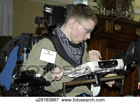 Man with cerebral palsy, sitting in wheelchair typing on a speech devise. View Large Photo Image Stock Photo - Man with cerebral palsy, sitting in wheelchair typing on a speech devise.. Fotosearch