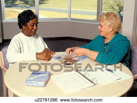 Older woman with a disability participating in medical/dietary assessment at a rehabilitation facility. View Large Photo Image Stock Photograph - Older woman with a disability participating in medical/dietary assessment at a rehabilitation facility.. Fotosearch