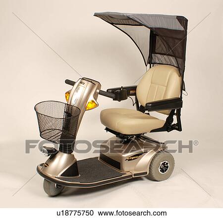 Stock Image - Sleek and modern scooter, with removable sun shade, for use by individuals with mobility impairments.. Fotosearch