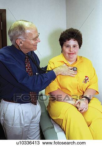 Woman with a disability undergoing a routine physical check-up/medical exam with a physician. View Large Photo Image Stock Image - Woman with a disability undergoing a routine physical check-up/medical exam with a physician.. Fotosearch