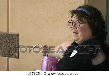 Woman with multiple physical disabilities using an adaptive device to smoke her cigarette. View Large Photo Image Stock Image - Woman with multiple physical disabilities using an adaptive device to smoke her cigarette.. Fotosearch
