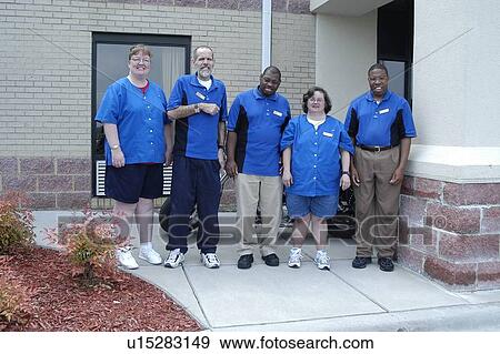 A group of housekeeping staff posing outside the building. View Large Photo Image Stock Photo - A group of housekeeping staff posing outside the building.. Fotosearch