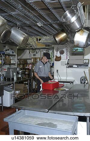 A man with disabilities is working in a commercial kitchen at a restaurant. View Large Photo Image Stock Photo - A man with disabilities is working in a commercial kitchen at a restaurant.. Fotosearch