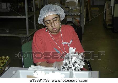 A woman with a disability working in food service. View Large Photo Image Stock Photo - A woman with a disability working in food service.. Fotosearch