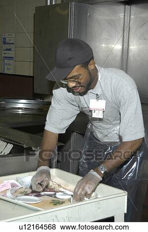 Man with disabilities in a commercial kitchen washing dishes. View Large Photo Image Stock Photo - Man with disabilities in a commercial kitchen washing dishes.. Fotosearch